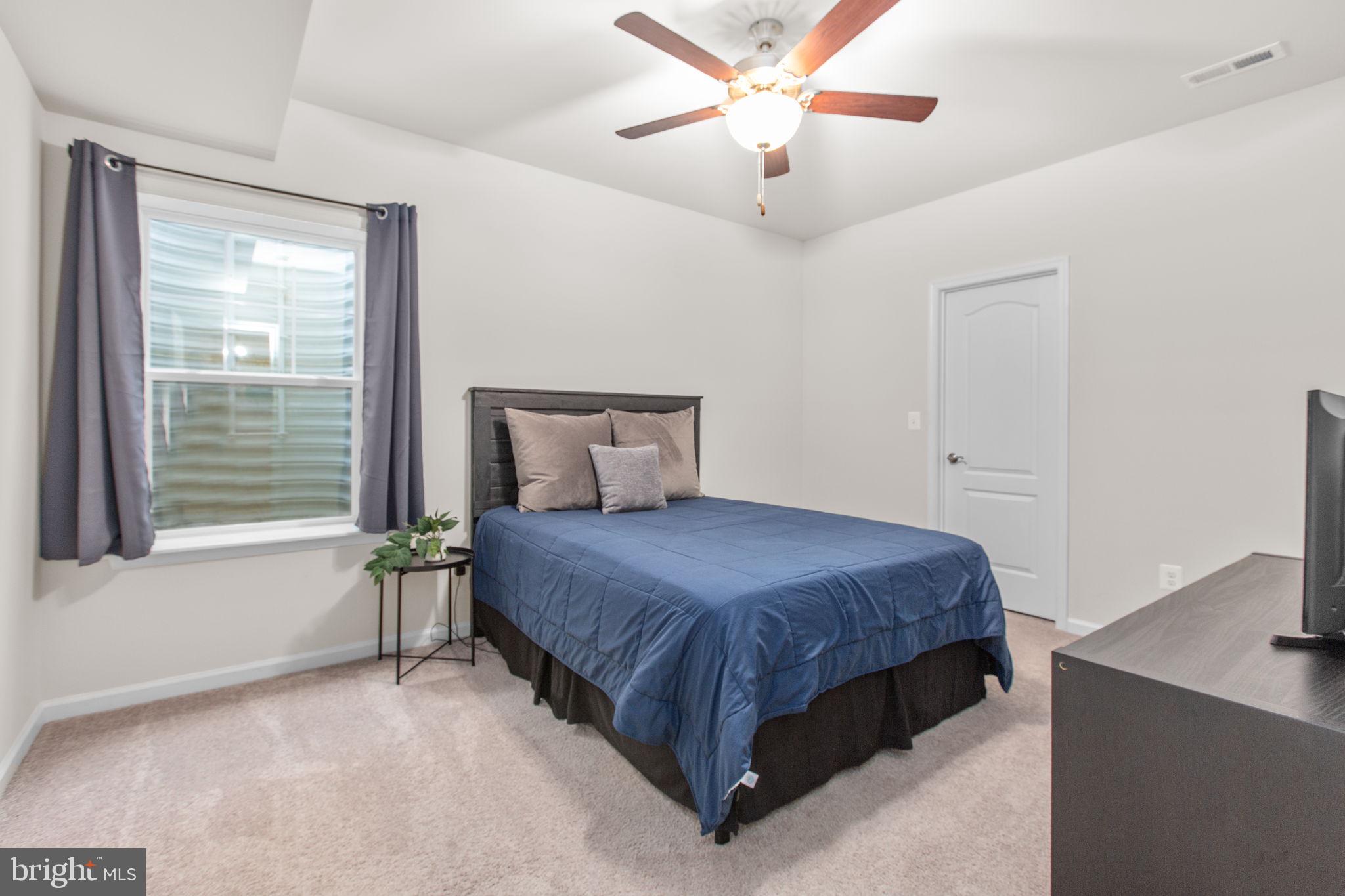 8 Shermans Ridge Road Stafford, VA 22554 - Photo 34 of 37 a bedroom with a bed and window