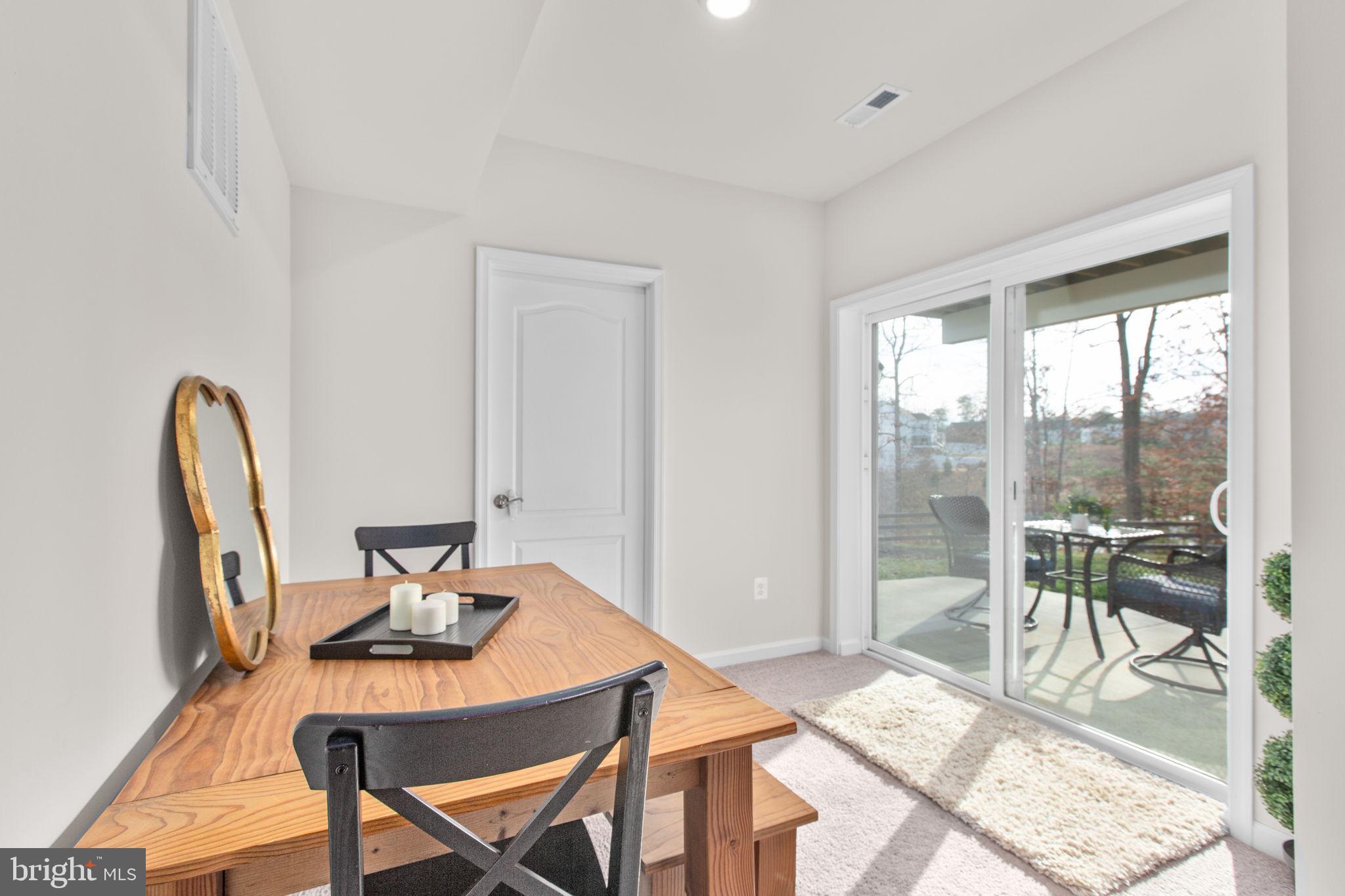 8 Shermans Ridge Road Stafford, VA 22554 - Photo 35 of 37 a view of a dining room with furniture wooden floor and a rug