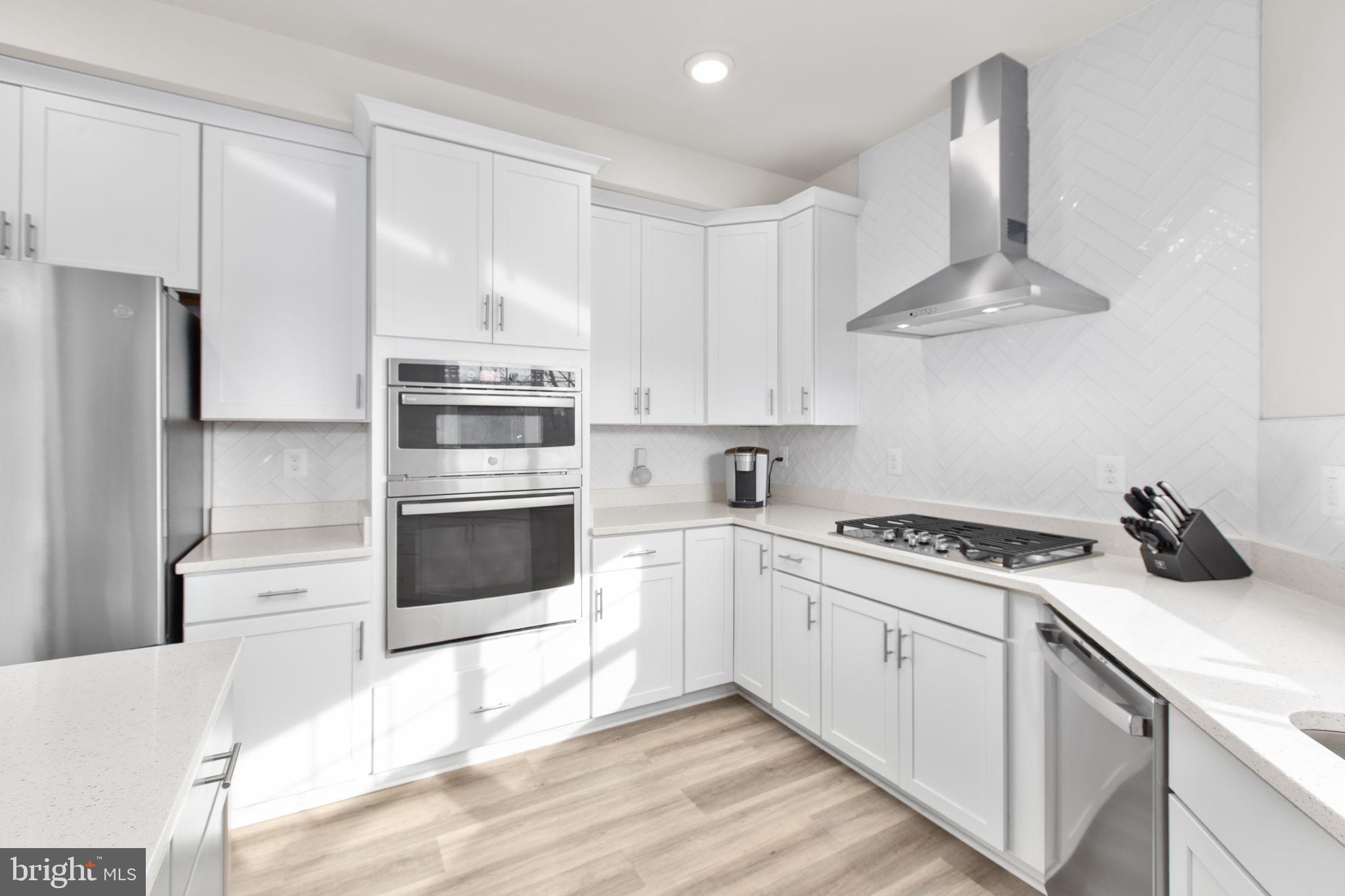 8 Shermans Ridge Road Stafford, VA 22554 - Photo 4 of 37 a kitchen with cabinets and stainless steel appliances