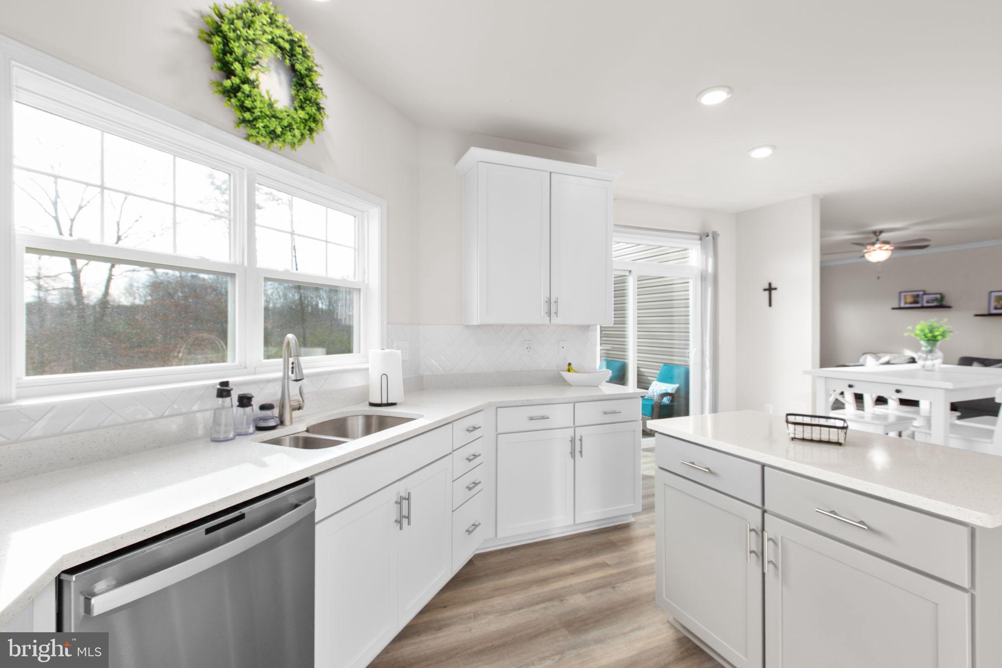 8 Shermans Ridge Road Stafford, VA 22554 - Photo 5 of 37 a kitchen with a sink stove and cabinets
