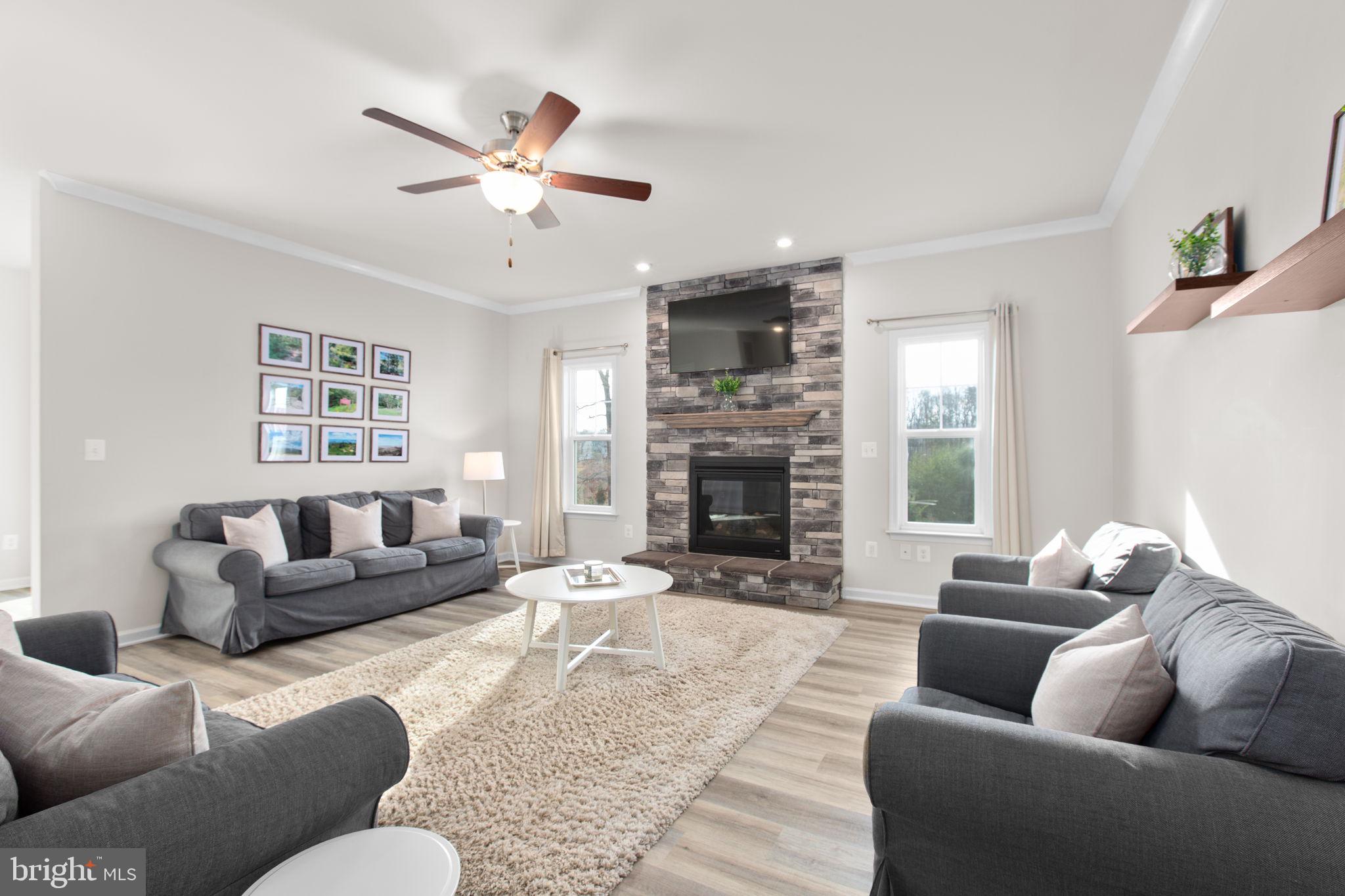 8 Shermans Ridge Road Stafford, VA 22554 - Photo 10 of 37 a living room with furniture and a fireplace