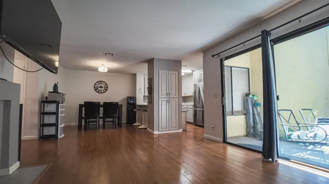a view of a dining room with furniture and wooden floor