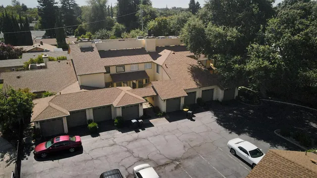 a view of a house with wooden deck