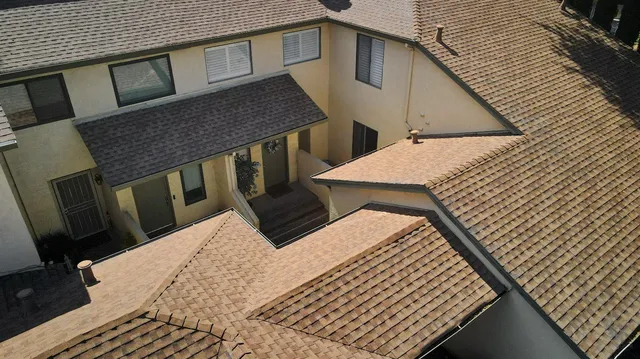 a view of a hallway with wooden floor and a livingroom