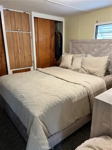 a bedroom with a bed and a tub