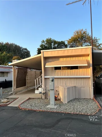 a view of a patio with a table and chairs