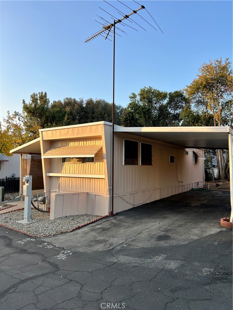 35080 Chandler Avenue, Unit 11 Calimesa, CA 92320 - Photo 3 of 20 a view of a blue house with a big yard