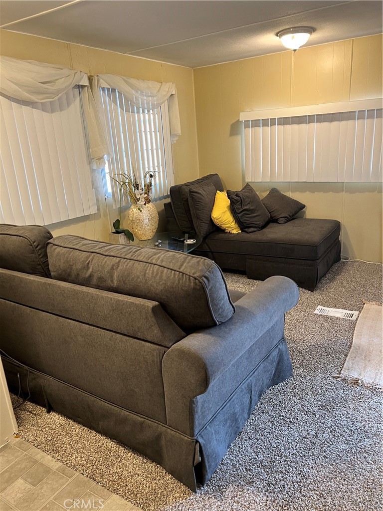 35080 Chandler Avenue, Unit 11 Calimesa, CA 92320 - Photo 8 of 20 a living room with furniture and a window