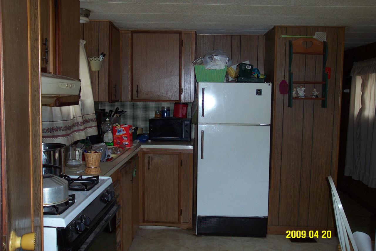 48 East Windsor Road Peru, MA 01235 - Photo 3 of 4 a kitchen with a refrigerator and a stove