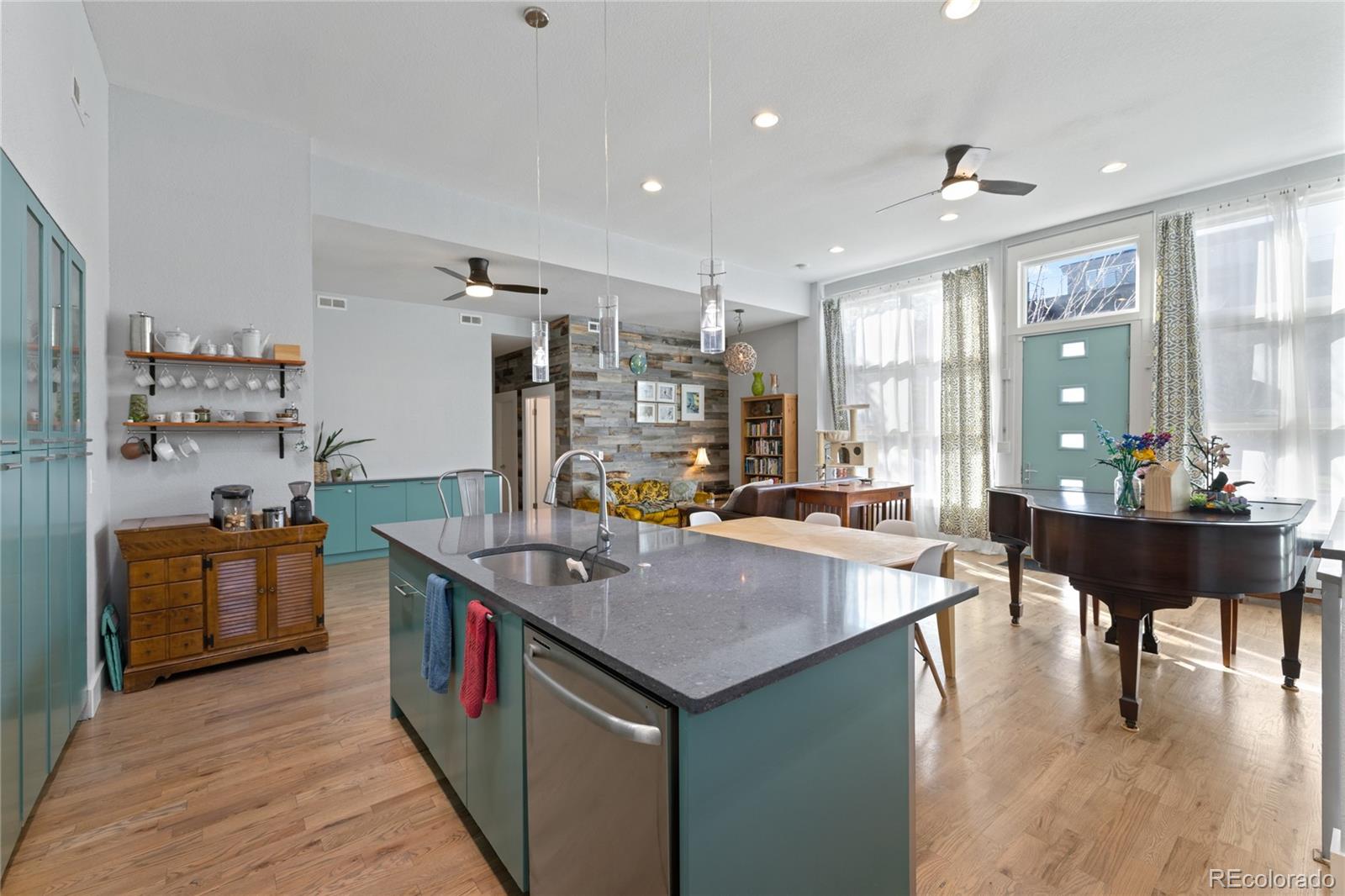 3460 North Pecos Street, Unit 1 Denver, CO 80211 - Photo 12 of 45 a kitchen with a stove and a refrigerator