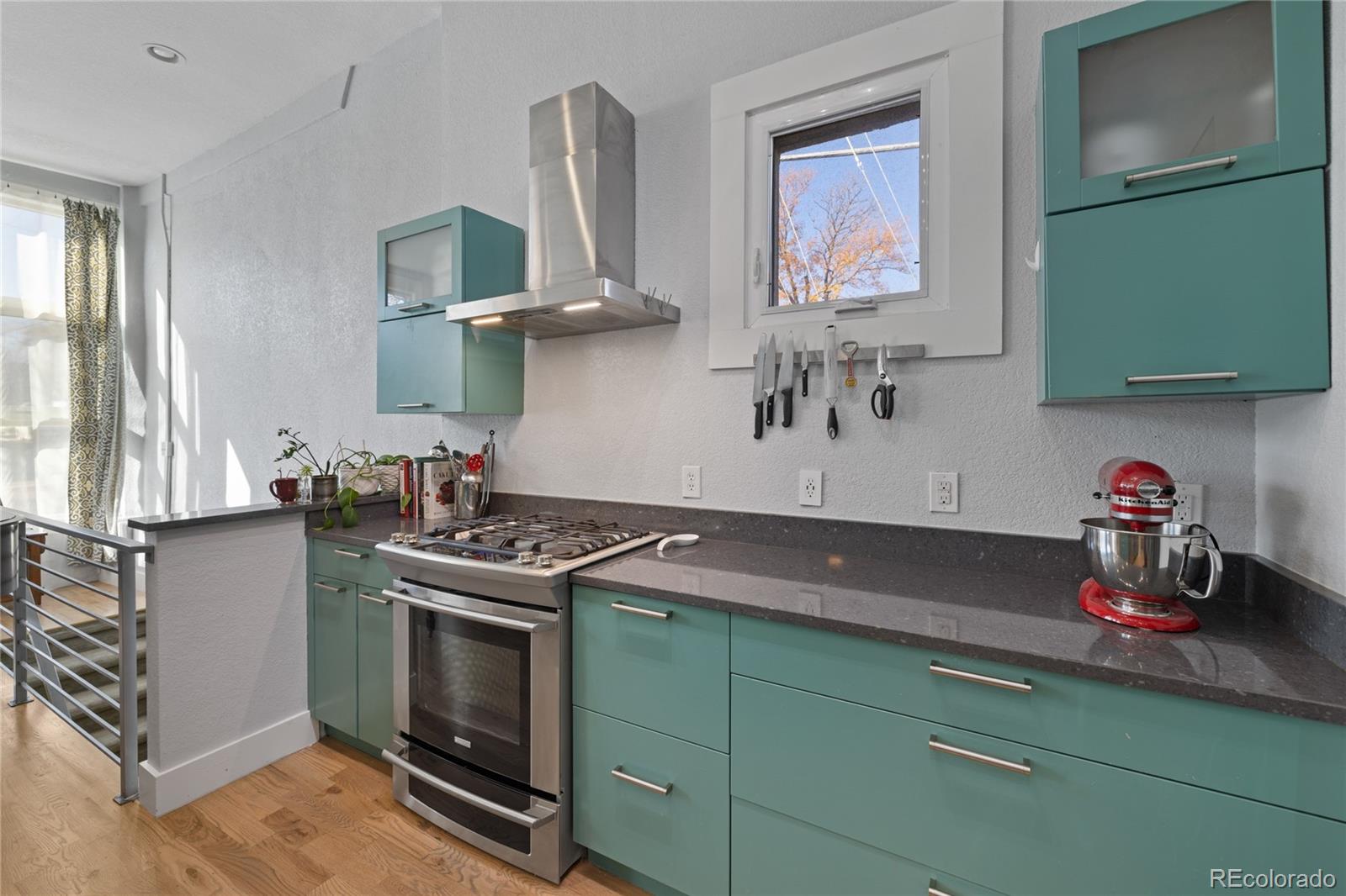 3460 North Pecos Street, Unit 1 Denver, CO 80211 - Photo 13 of 45 a kitchen with stainless steel appliances granite countertop a stove and a sink