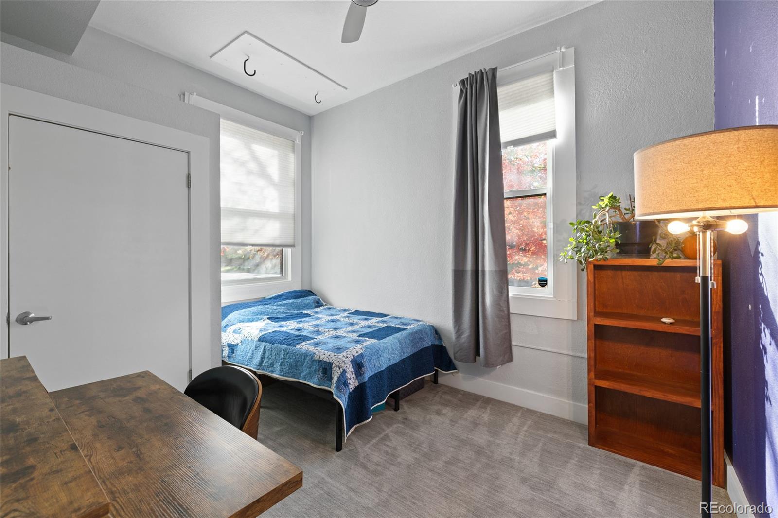 3460 North Pecos Street, Unit 1 Denver, CO 80211 - Photo 20 of 45 a bedroom with a bed and a dresser