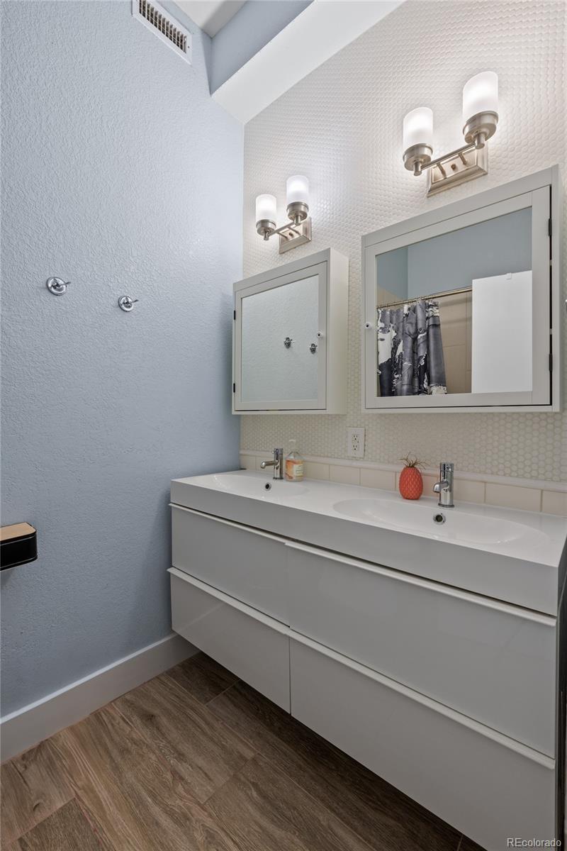 3460 North Pecos Street, Unit 1 Denver, CO 80211 - Photo 23 of 45 a bathroom with a bathtub and a sink