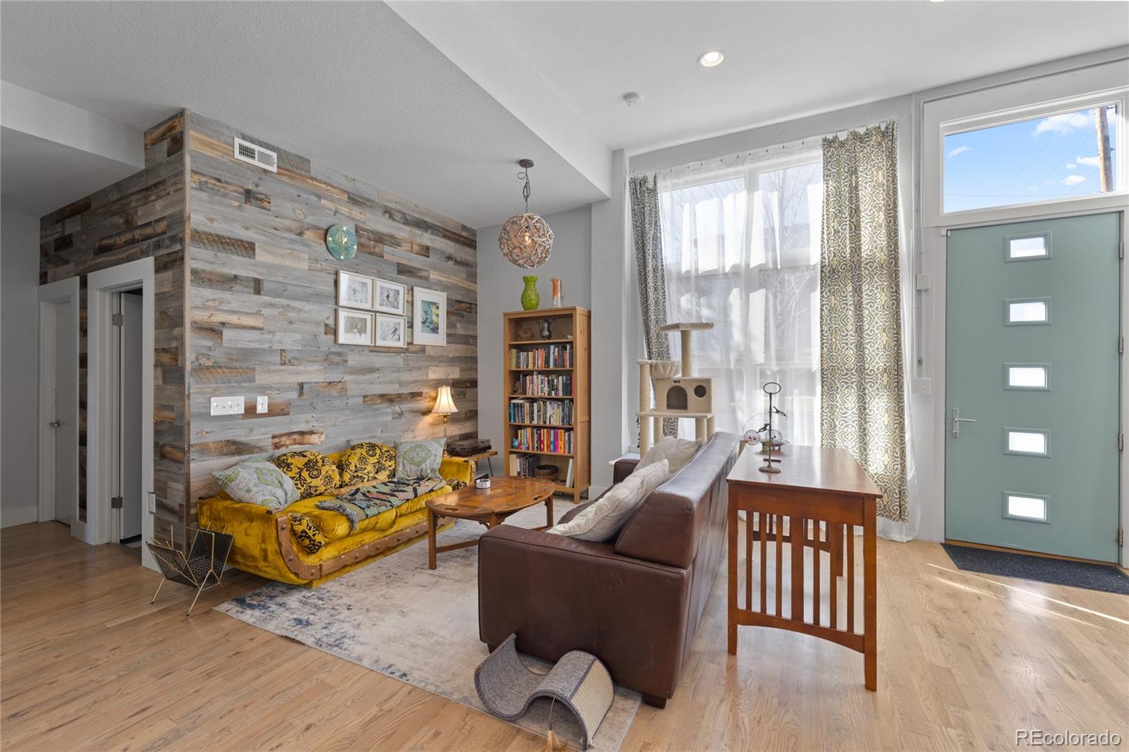 3460 North Pecos Street, Unit 1 Denver, CO 80211 - Photo 3 of 45 a living room with furniture and wooden floor