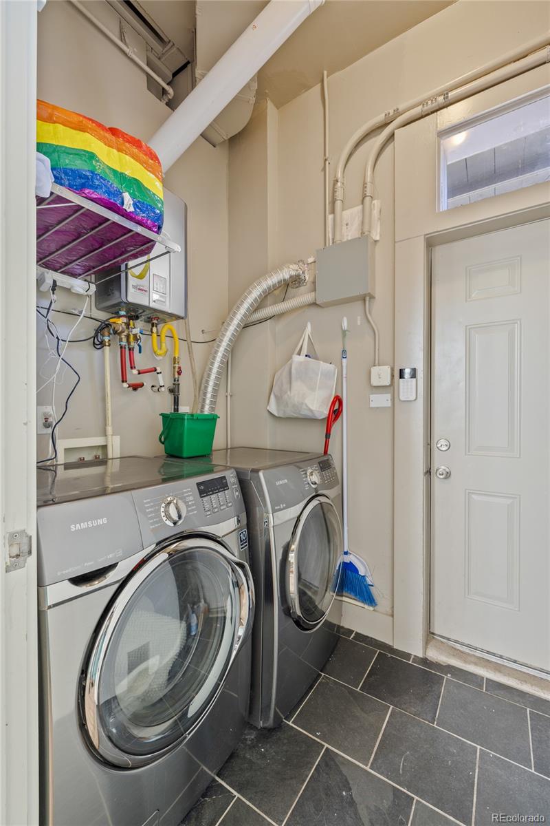 3460 North Pecos Street, Unit 1 Denver, CO 80211 - Photo 31 of 45 a utility room with dryer and washer
