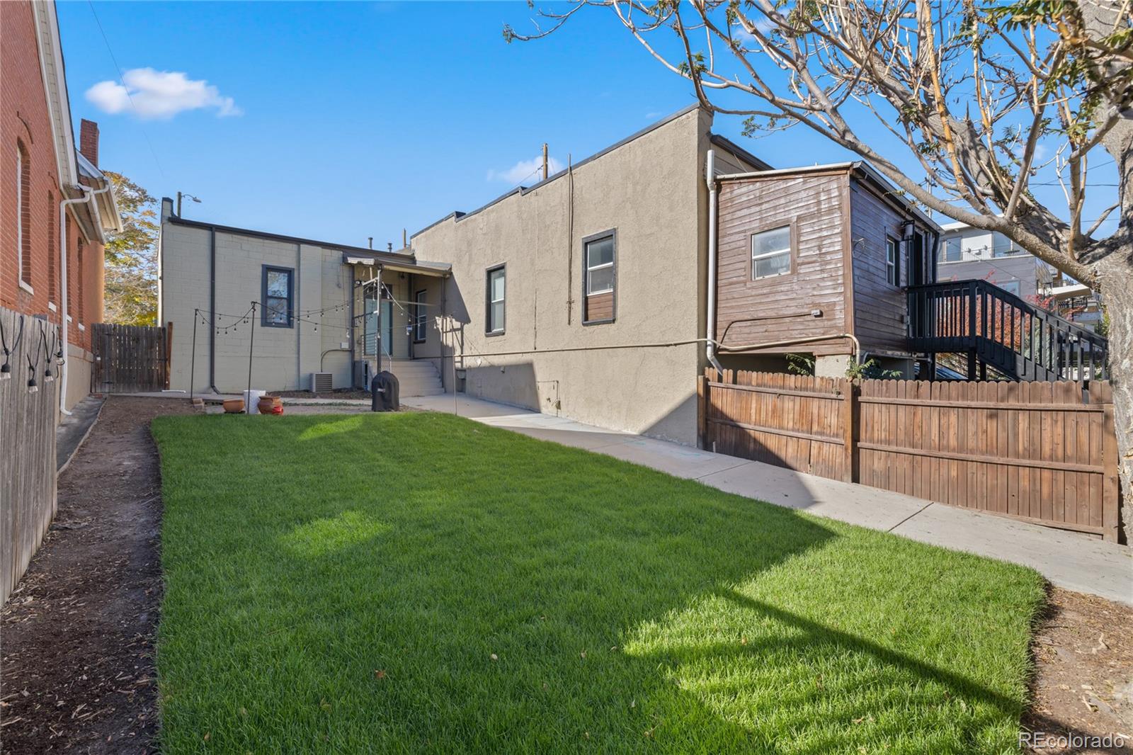 3460 North Pecos Street, Unit 1 Denver, CO 80211 - Photo 33 of 45 a view of a house with backyard and sitting area