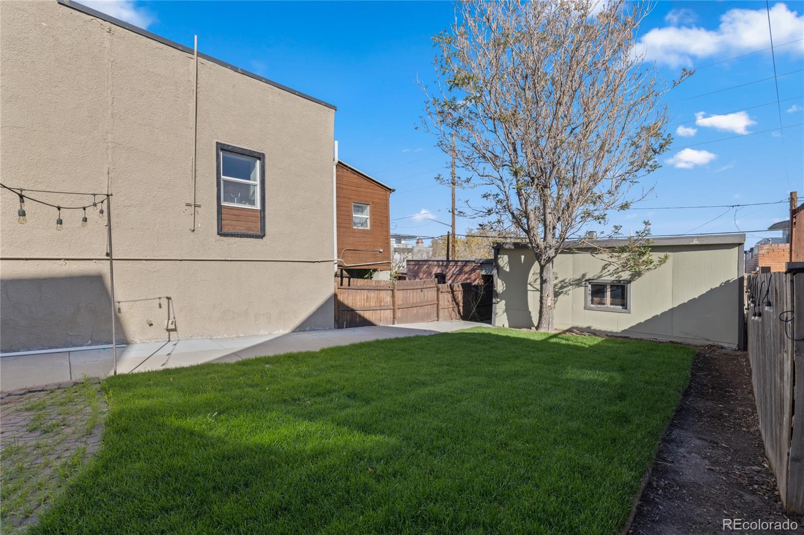 3460 North Pecos Street, Unit 1 Denver, CO 80211 - Photo 34 of 45 a view of a house with a yard