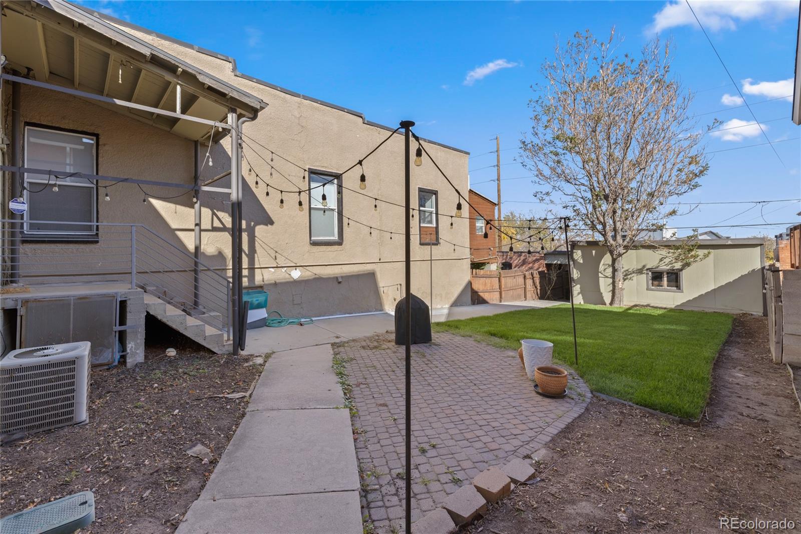 3460 North Pecos Street, Unit 1 Denver, CO 80211 - Photo 35 of 45 a view of a house with a yard