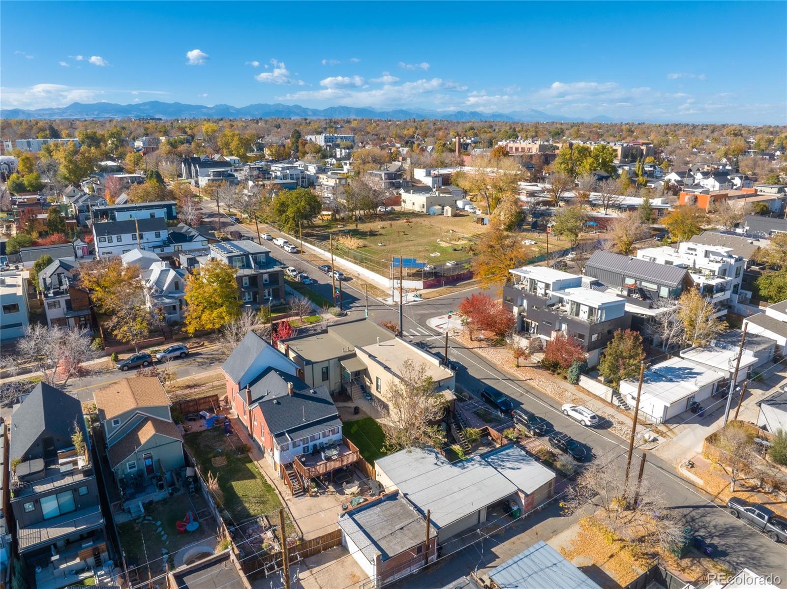3460 North Pecos Street, Unit 1 Denver, CO 80211 - Photo 39 of 45 an aerial view of a city with lots of residential buildings and ocean view in back