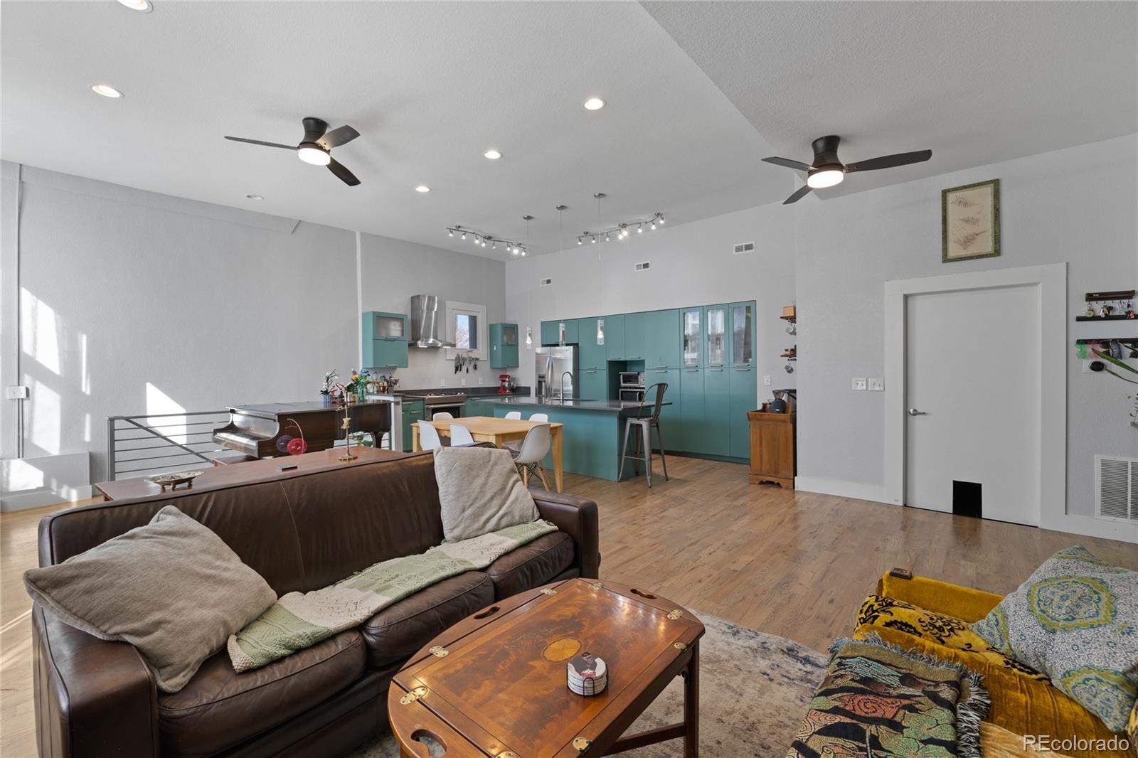 3460 North Pecos Street, Unit 1 Denver, CO 80211 - Photo 5 of 45 a living room with furniture and kitchen view