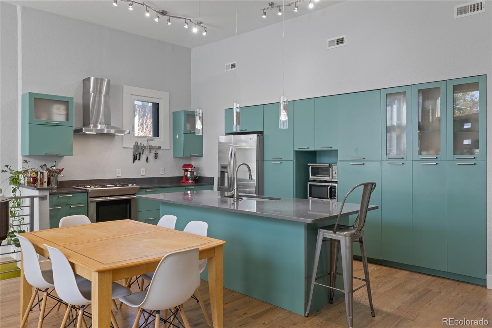 3460 North Pecos Street, Unit 1 Denver, CO 80211 - Photo 8 of 45 a kitchen with a table and chairs in it