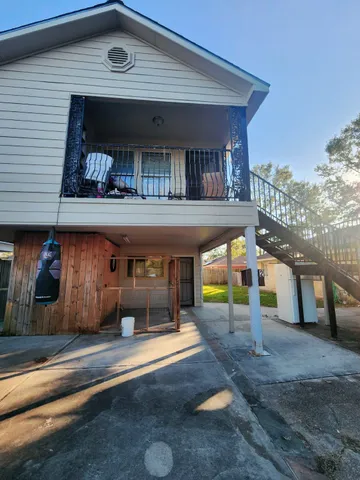 a view of a building with a porch