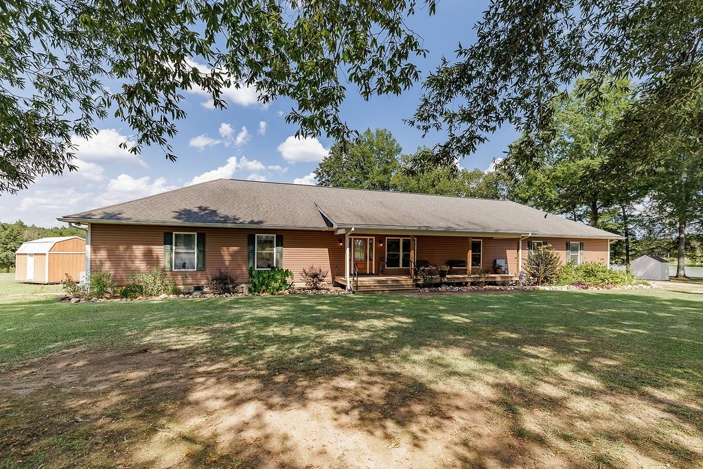 625 Happy Hollow Road Washington, GA 30673 - Photo 12 of 50 a front view of a house with a garden