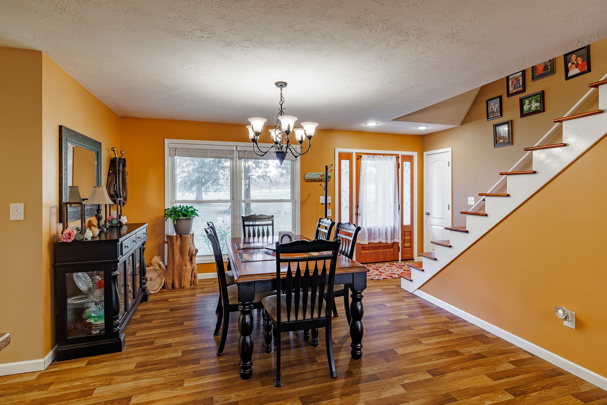 625 Happy Hollow Road Washington, GA 30673 - Photo 13 of 50 a view of a dining room with furniture window and wooden floor