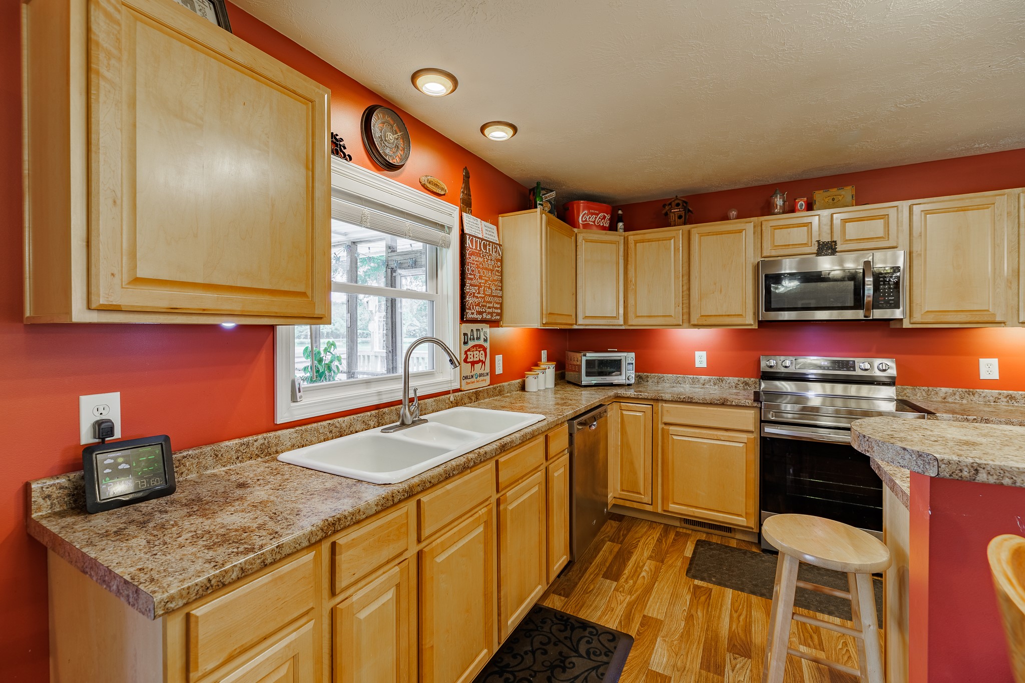 625 Happy Hollow Road Washington, GA 30673 - Photo 18 of 50 a kitchen with stainless steel appliances granite countertop a sink stove and refrigerator