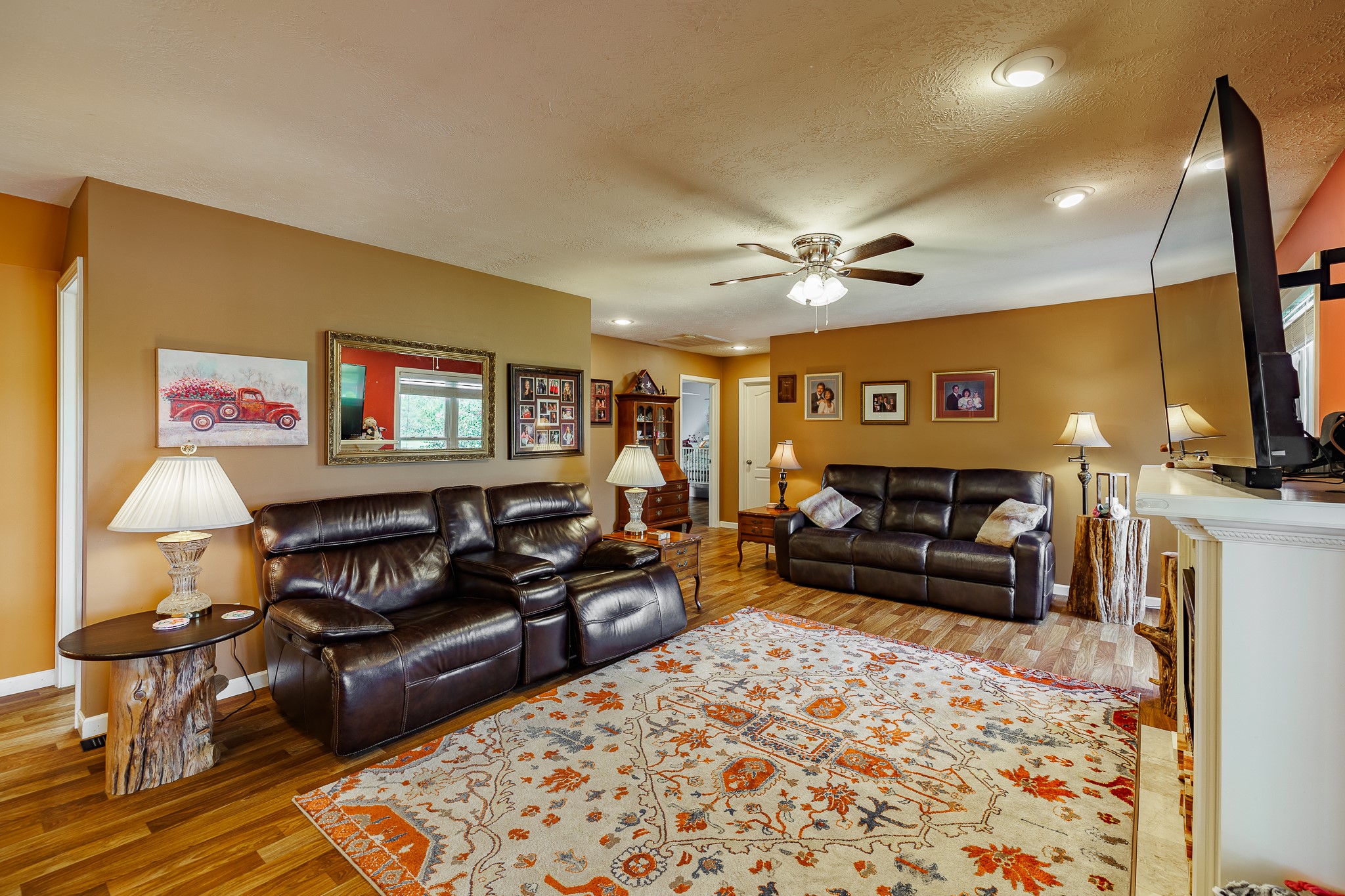 625 Happy Hollow Road Washington, GA 30673 - Photo 22 of 50 a living room with furniture and a flat screen tv