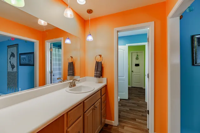 a bathroom with a sink and a mirror