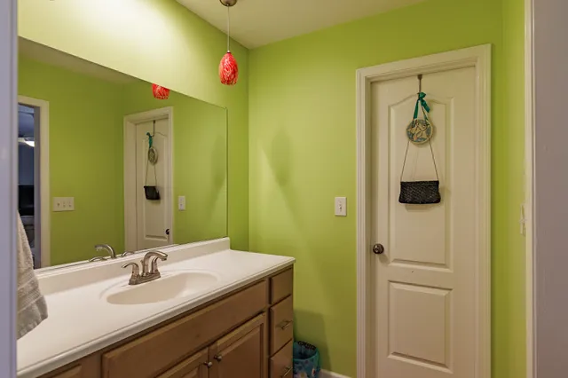 a bathroom with a sink a mirror and a shower