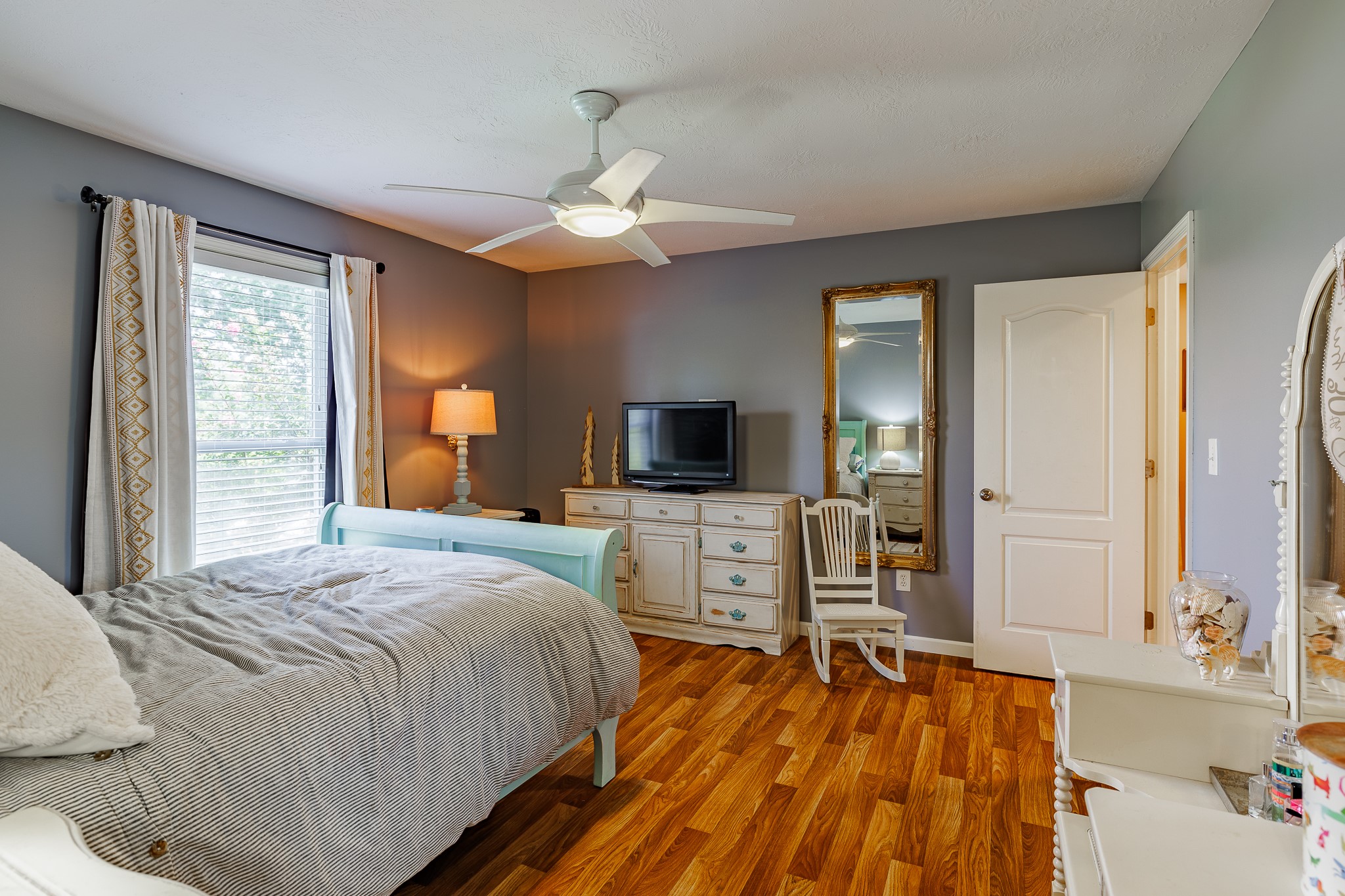 625 Happy Hollow Road Washington, GA 30673 - Photo 28 of 50 a bedroom with a bed and a flat screen tv
