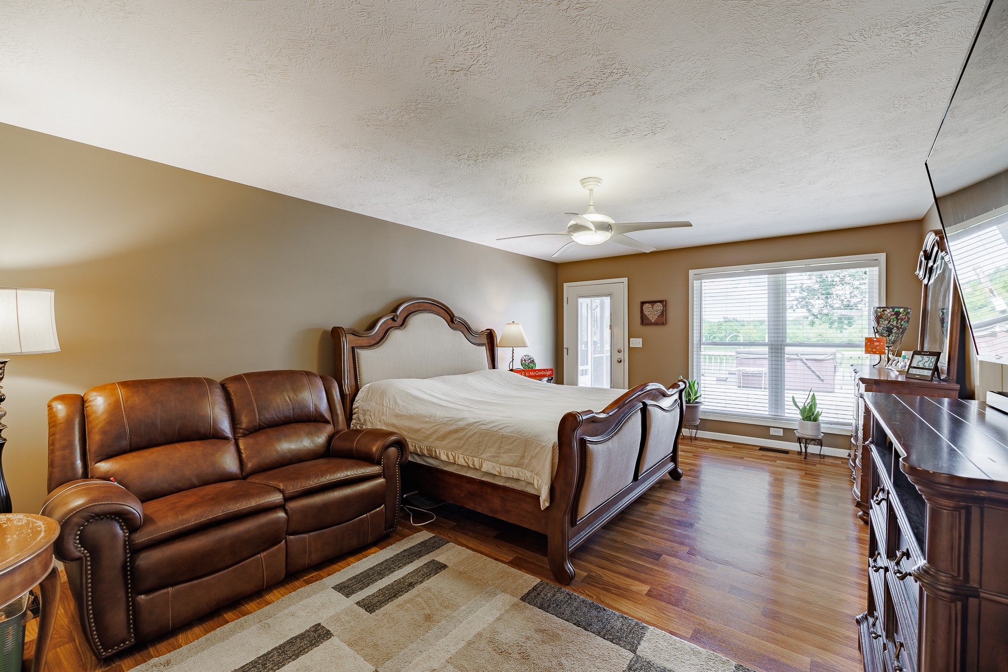 625 Happy Hollow Road Washington, GA 30673 - Photo 33 of 50 a bedroom with bed couch and window