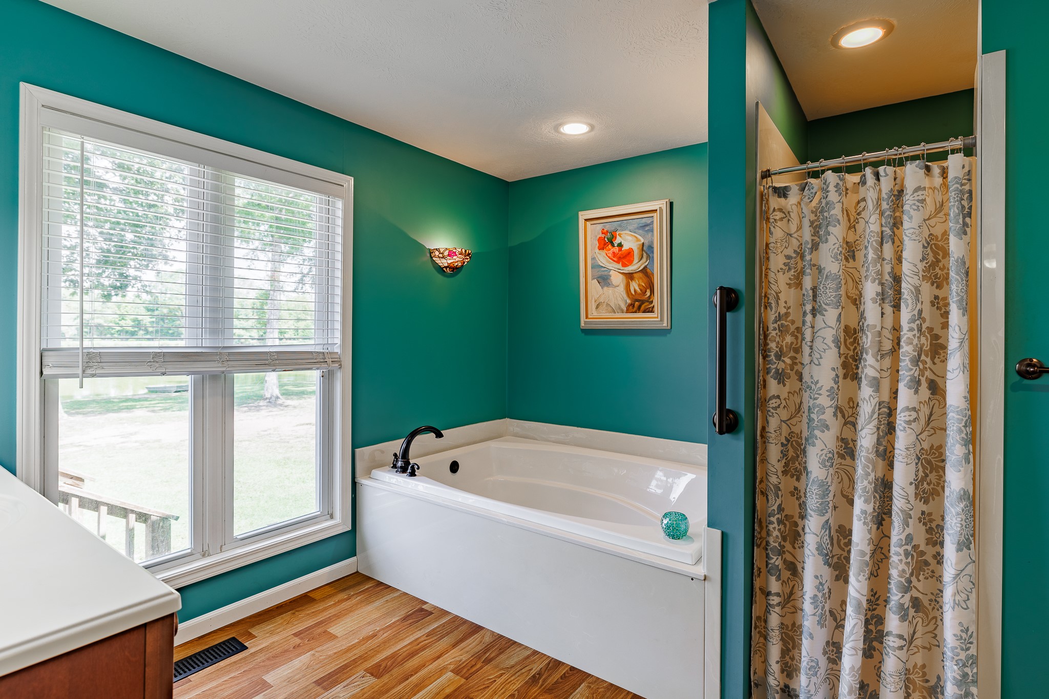 625 Happy Hollow Road Washington, GA 30673 - Photo 35 of 50 a bathroom with a bathtub and a window