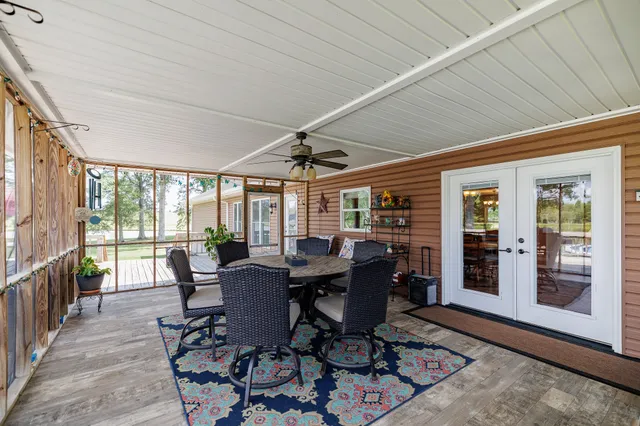 a view of a patio with chairs and a table