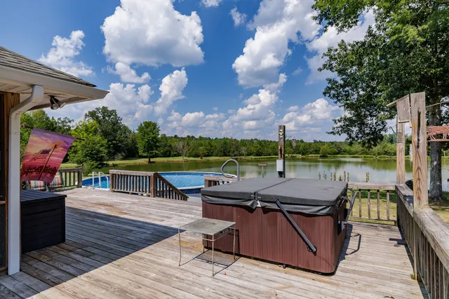 a view of a swimming pool with a yard
