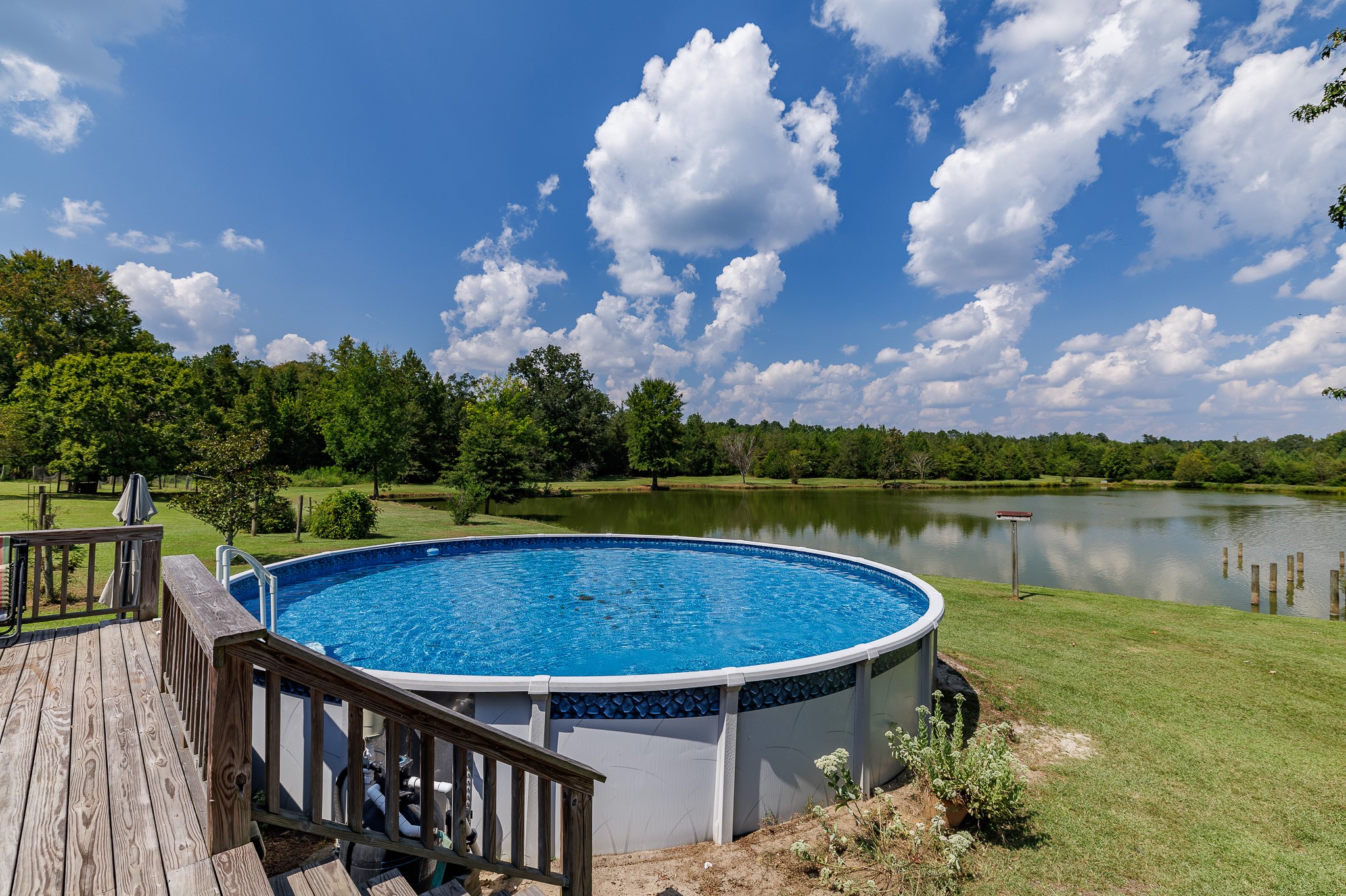 625 Happy Hollow Road Washington, GA 30673 - Photo 41 of 50 a view of a swimming pool with a yard