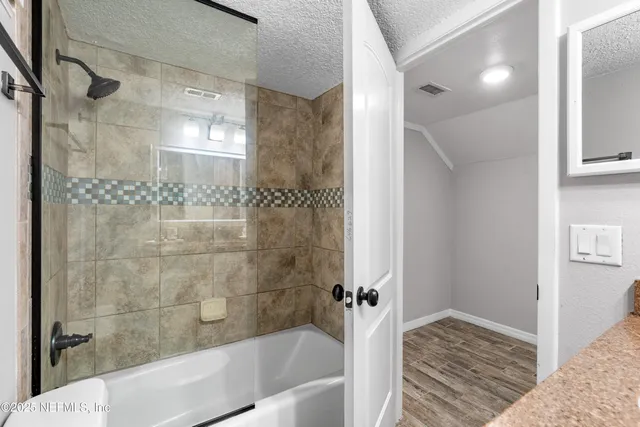 a view of hallway with wooden floor