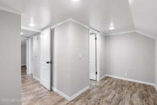 a view of a house with backyard and wooden floor
