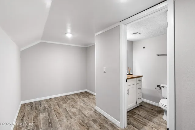 a view of a house with a yard and garage