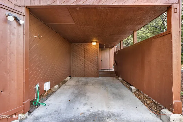 an aerial view of residential house with outdoor space and swimming pool