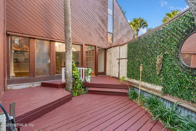 an aerial view of residential house with outdoor space and swimming pool