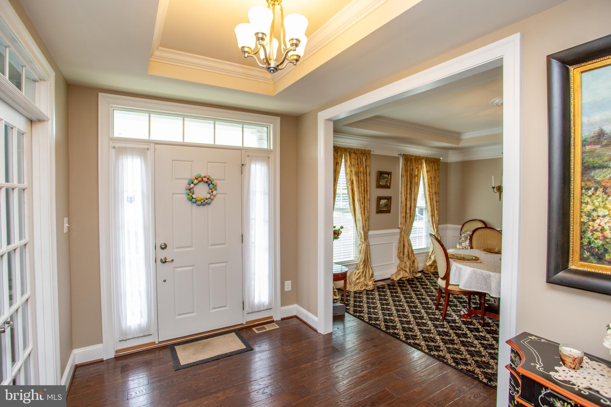 4682 Plough Tavern Road Doylestown, PA 18902 - Photo 3 of 42 a view of a livingroom with wooden floor and windows
