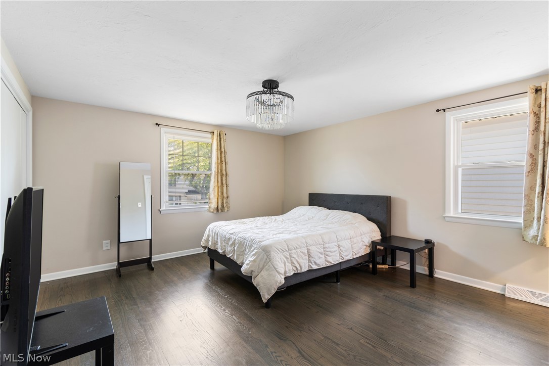 4503 Groveland Road University Heights, OH 44118 - Photo 18 of 31 Bedroom with an inviting chandelier and dark hardwood / wood-style floors