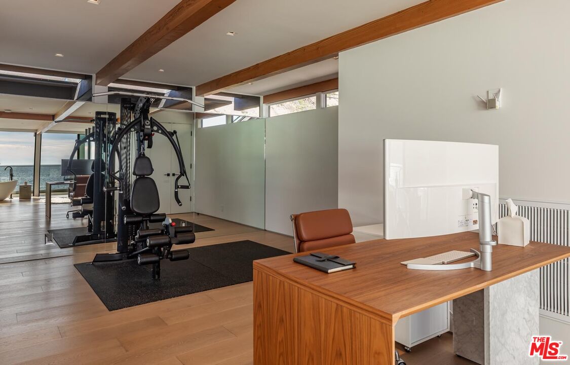 24548 Malibu Road Malibu, CA 90265 - Photo 19 of 28 a room with gym equipment and view of living room