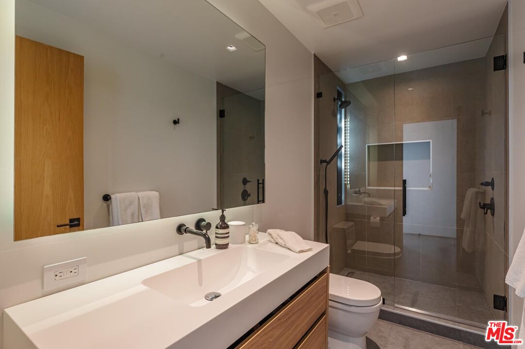 24548 Malibu Road Malibu, CA 90265 - Photo 23 of 28 a bathroom with a sink toilet and shower