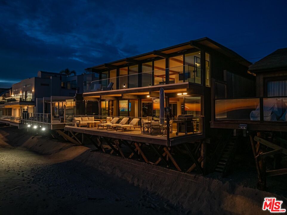 24548 Malibu Road Malibu, CA 90265 - Photo 28 of 28 a front view of a house with yard and balcony