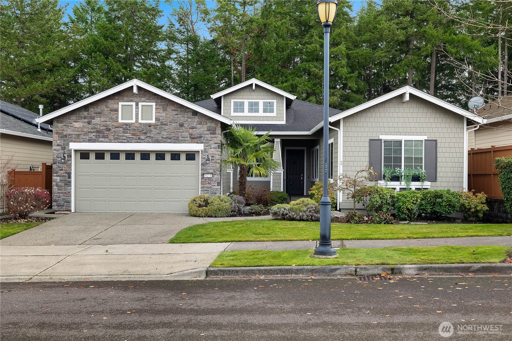 8265 Orcas Loop Northeast Lacey, WA 98516 - Photo 1 of 39 a front view of a house with a yard