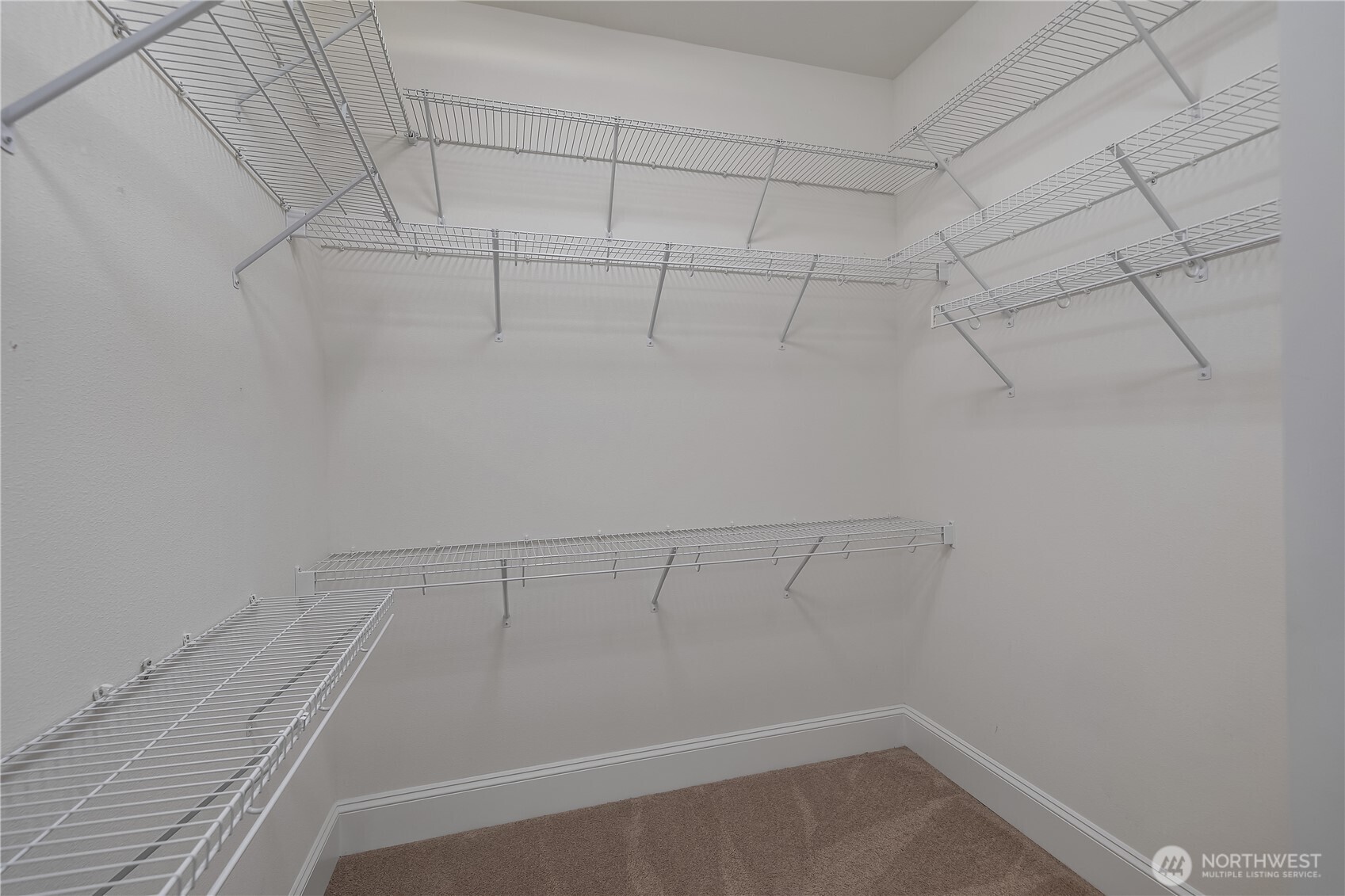 8265 Orcas Loop Northeast Lacey, WA 98516 - Photo 12 of 39 a view of a room with racks on the wall